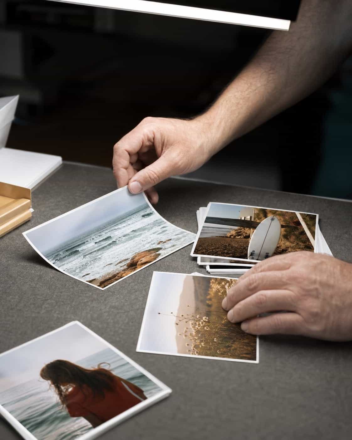 A photo lab technician checking a finished family print