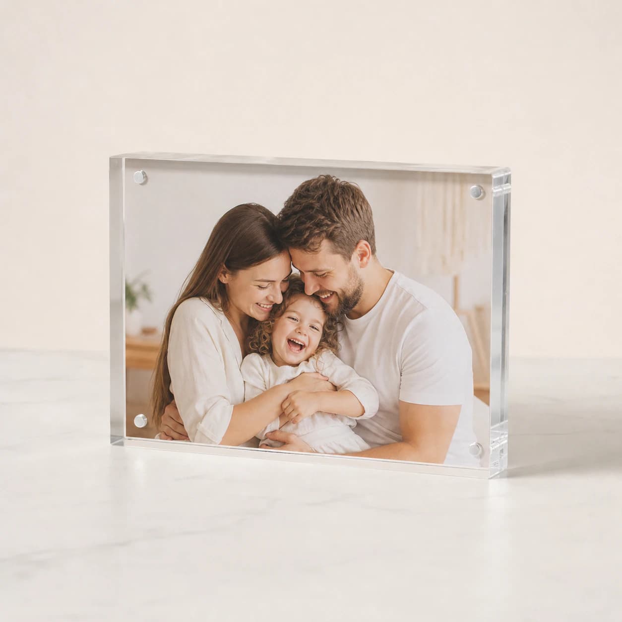 Crystal-clear personalised acrylic photo block in a studio setting